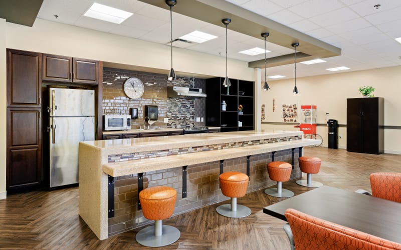 Communal dining area with bar stools at Anthology of Olathe in Olathe, Kansas