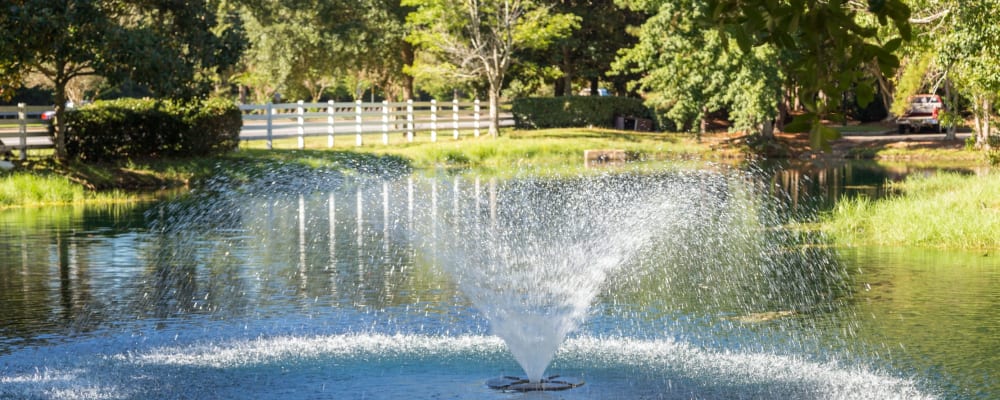 A water fountain in the community pond at Arbor Gates in Fairhope, Alabama