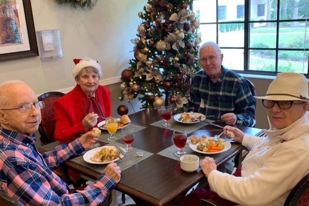 Residents enjoying a meal at Christmas at Inspired Living Sarasota in Sarasota, Florida. 