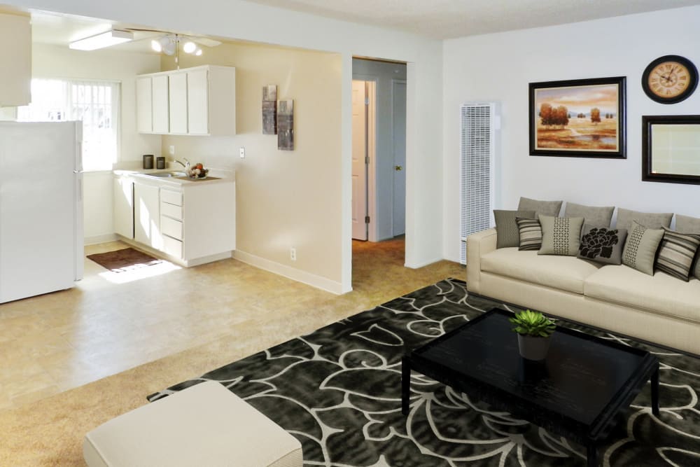 Model living room and kitchen at Mountain View Apartments in Concord, California