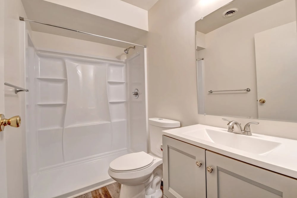 Bathroom with a toilet, bathtub and a shower at Woodside Village in Valparaiso, Indiana