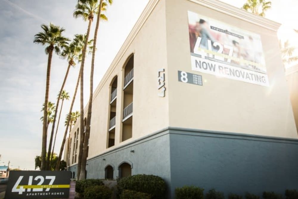 Outside of complex with inviting palm trees and view of units with private balconies at 4127 Arcadia in Phoenix, Arizona