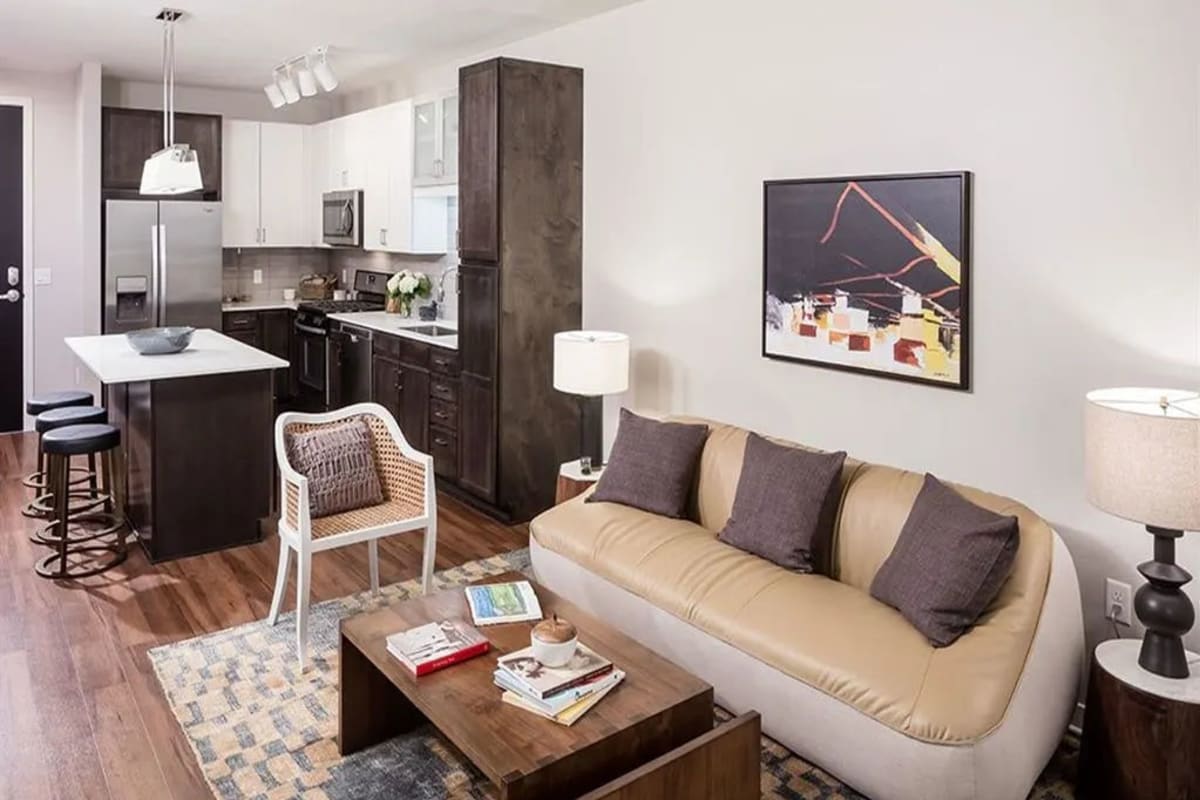 Furnished apartment living room with wood-style flooring at Foundry Lake Street in Minneapolis, Minnesota