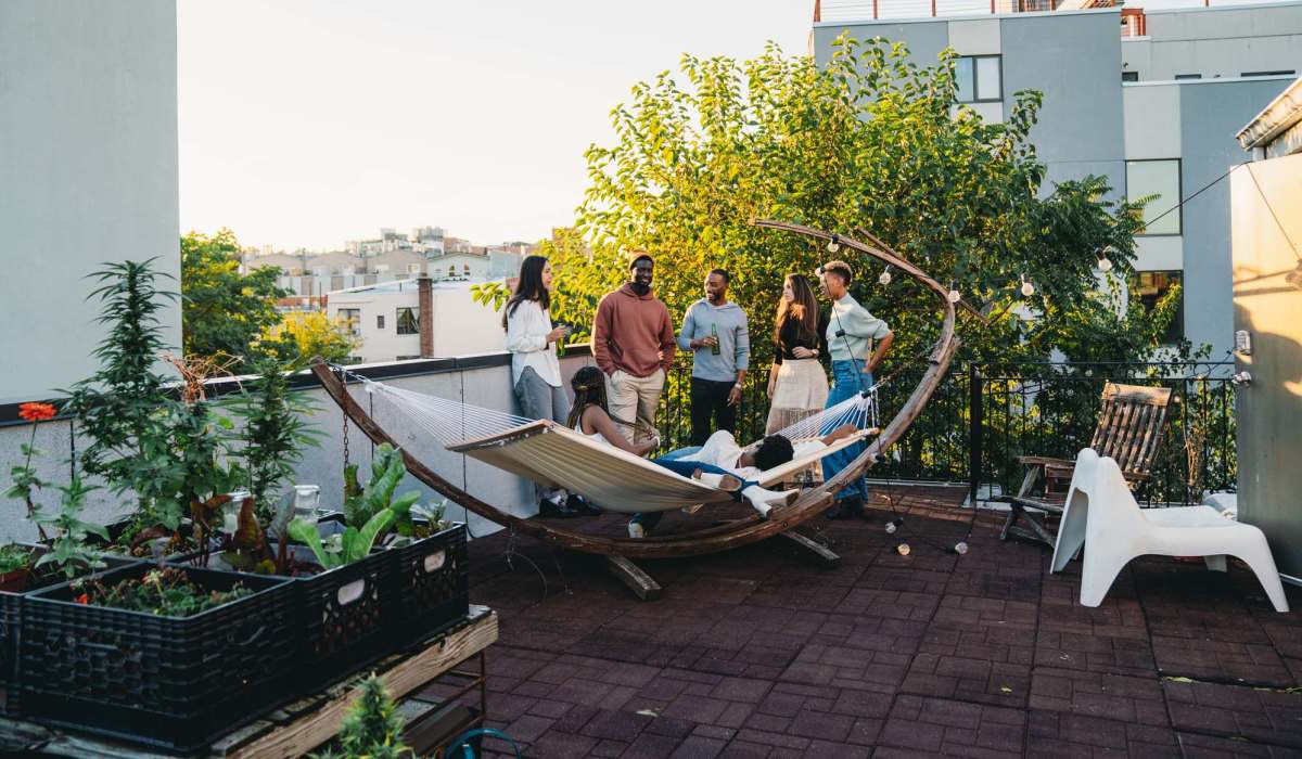 Residents hanging out atrooftop near Mily on Green in Philadelphia, Pennsylvania