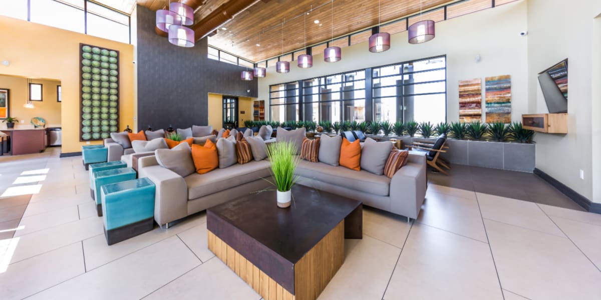 Community clubhouse with several sitting couches at Marquis at Desert Ridge in Phoenix, Arizona