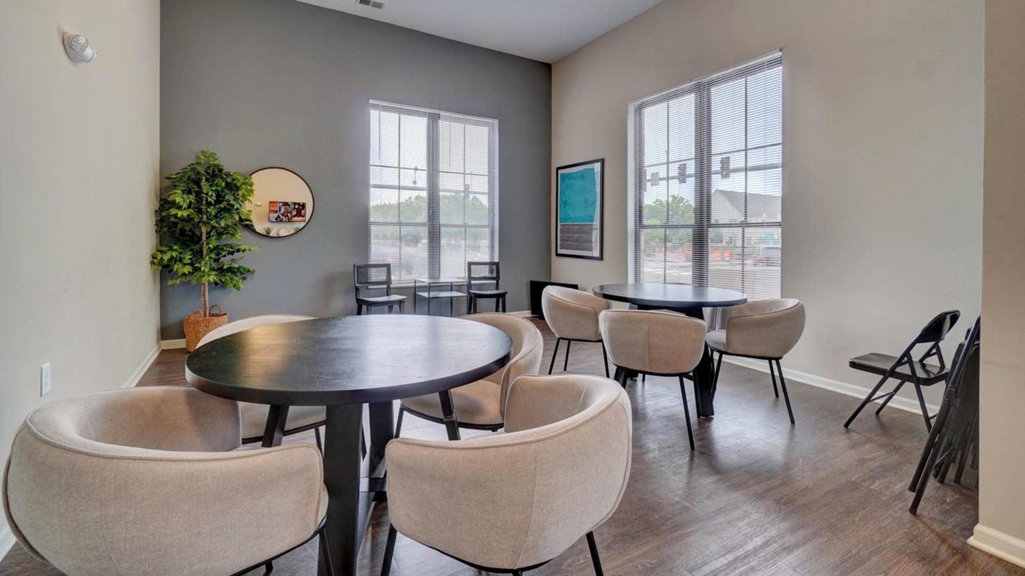 Community sitting area with wood flooring at Holley Pointe in Portsmouth. VA