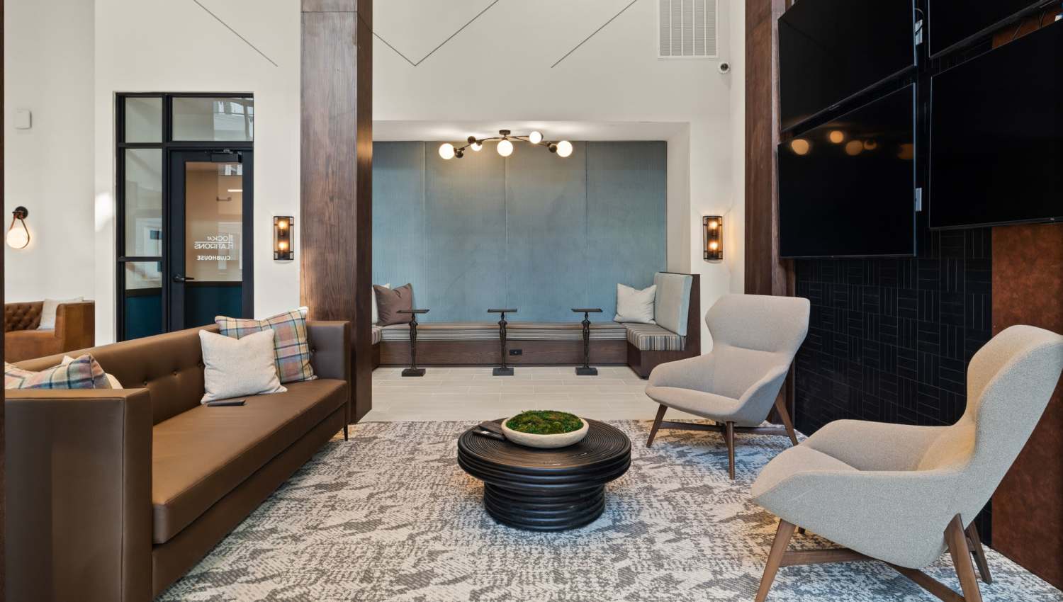 Spacious sitting area in community clubhouse at The Lock at Flatirons in Broomfield, Colorado