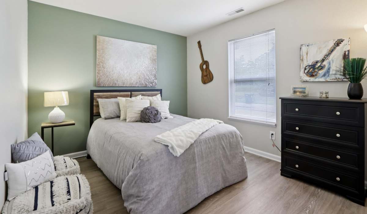 Bedroom with large comfortable bed at Broadway Village Apartments in Greenfield,Indiana