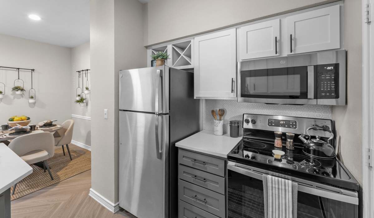 Kitchen with stainless-steel appliances at Station 3700 in Euless, Texas