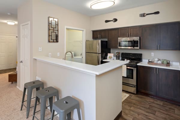 brown renovation Kitchen at HighGrove Apartments in Everett