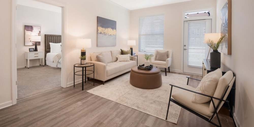 Spacious living area with wood-style vinyl flooring at Reflection Pointe TN in Ooltewah, Tennessee