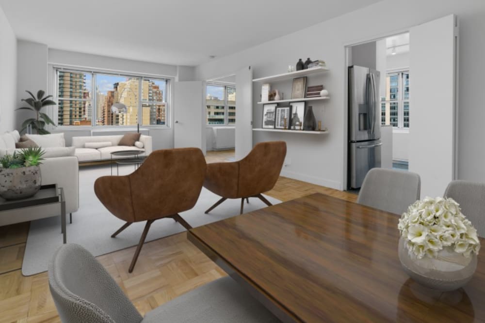 Model living room with large windows at The Caldwell in New York, New York