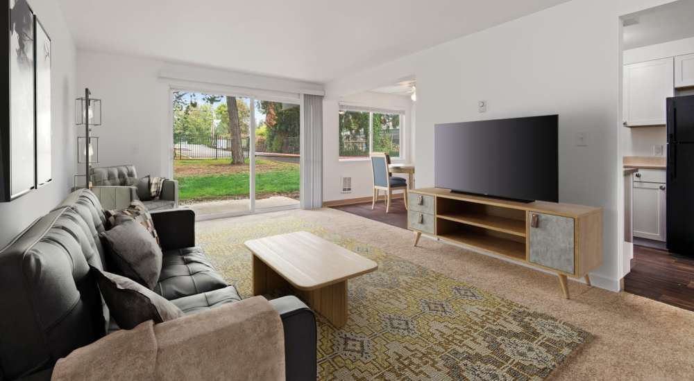 Model apartment home with sliding door access to a private patio and the courtyard at Bluffs at Evergreen in Everett, Washington