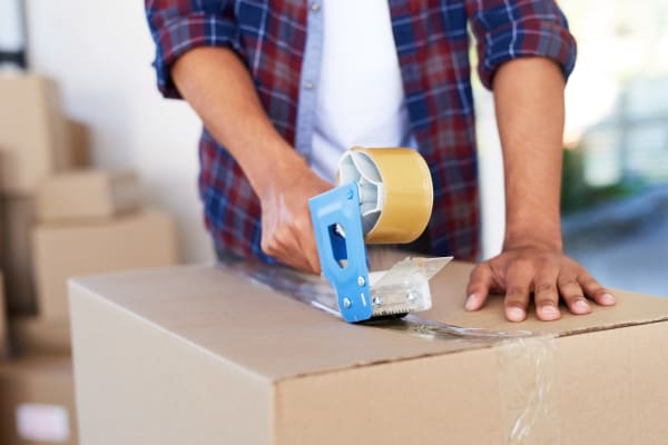 Customer packing a box at Security Self-Storage in Atlanta, Georgia