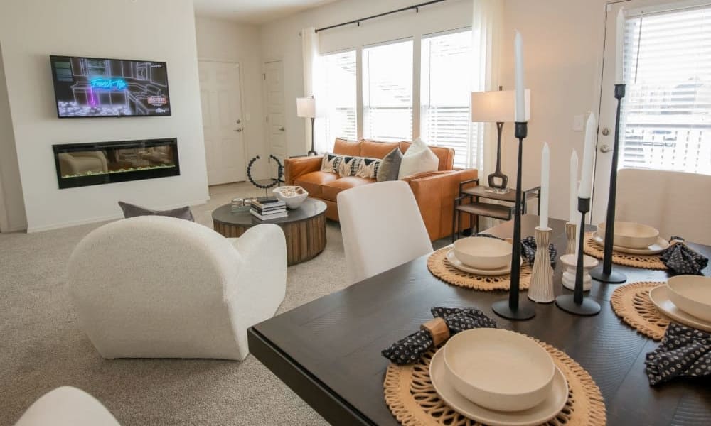 Bright and open living room and dining table at Center 301 Apartments in Belton, Missouri