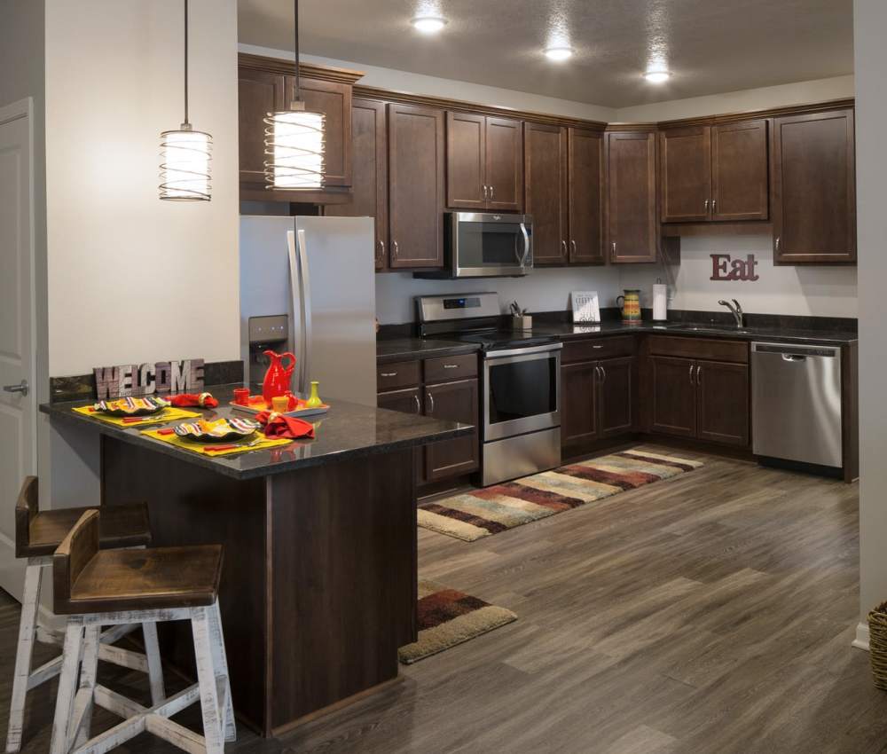 Kitchen with wooden flooring at The Phoenix in Ames, Iowa