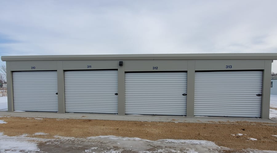 Exterior view of storage units with white doors at KO Storage of Albert Lea in Albert Lea, Minnesota