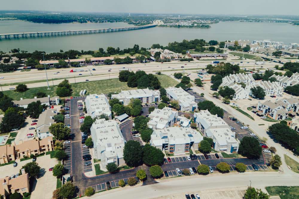 Community with lake view in drone shot at Hubbards Ridge in Garland, Texas