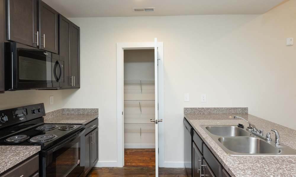 Kitchen with stainless steel appliances at Lofts at Inman Mills in Inman, South Carolina