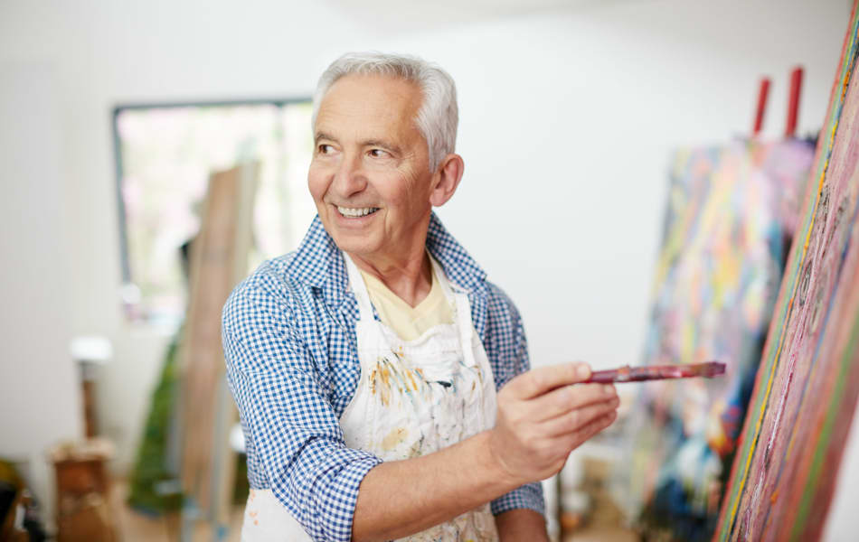 Resident taking a painting class at BPM Senior Living