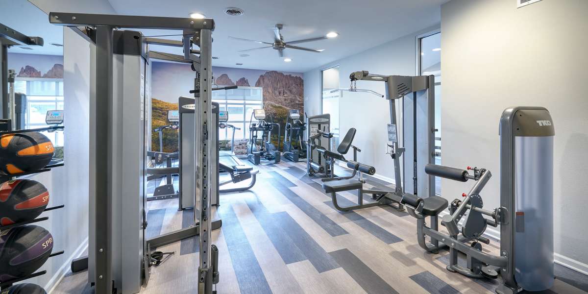 Fitness center with plenty of individual workout stations at Alton Green Apartments in Denver, Colorado