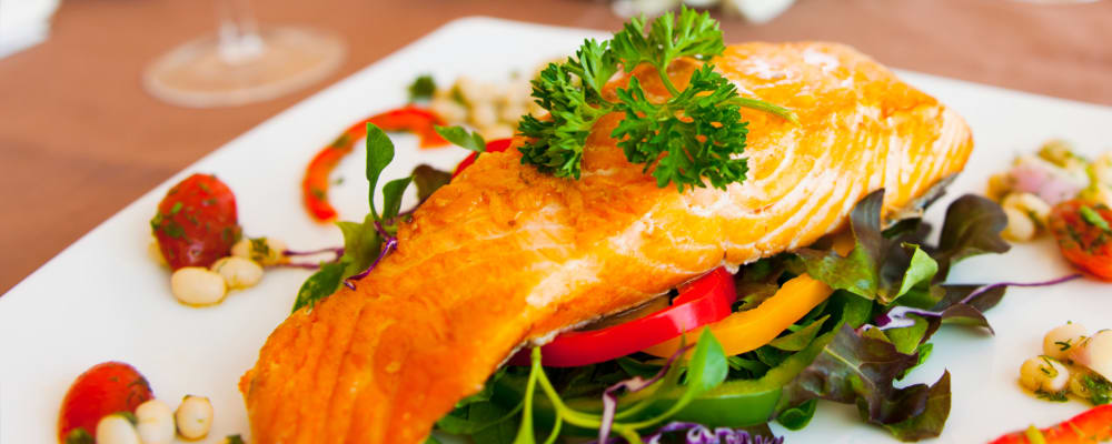 Fresh grilled salmon on a plate at The Springs at Lancaster Village in Salem, Oregon