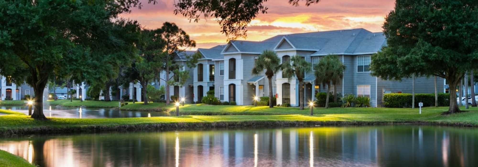 A wide exterior view of the apartments at Woodmere Apartments of Venice in Venice, Florida