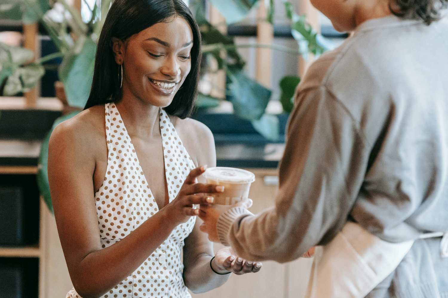 A woman purchasing coffee near RIVA Solana Beach in Solana Beach,California