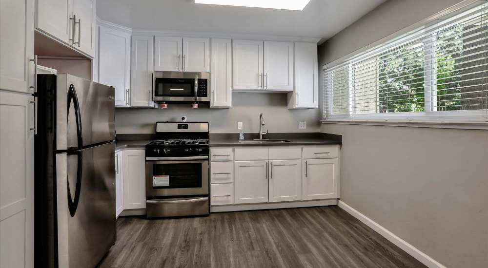 Fully- furnished kitchen with stainless stell appliances at Santa Teresa Apartments in San Jose, California
