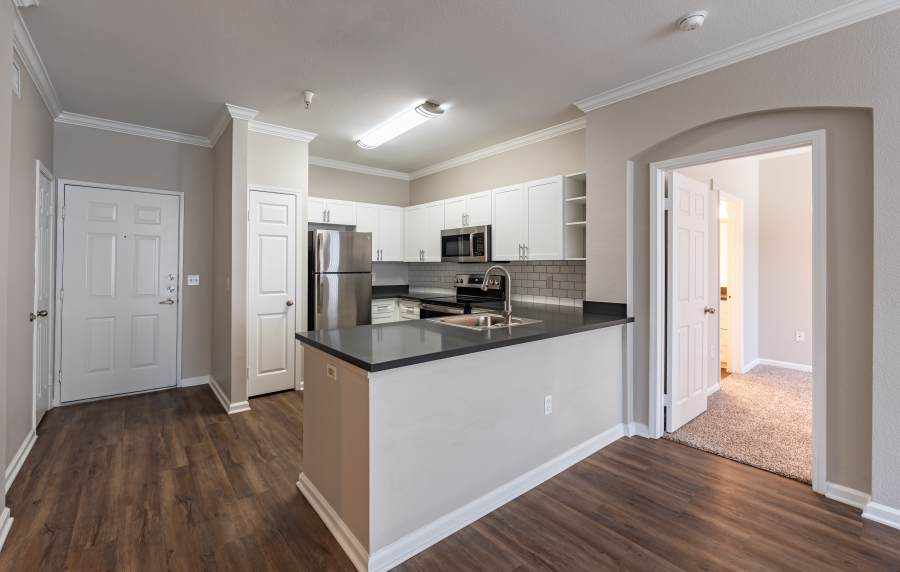 White kitchen with stainless-steel appliances at Links at Westridge in Valencia, California