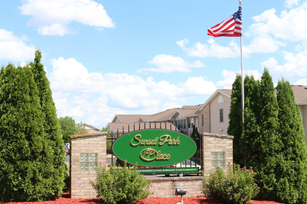 Exterior view of apartments and sign at Sunset Park Place in Dubuque, Iowa.
