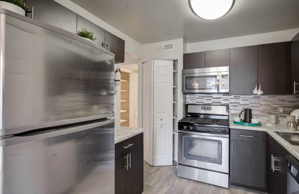 Kitchen in a model home at East Meadow Apartments in Fairfax, Virginia