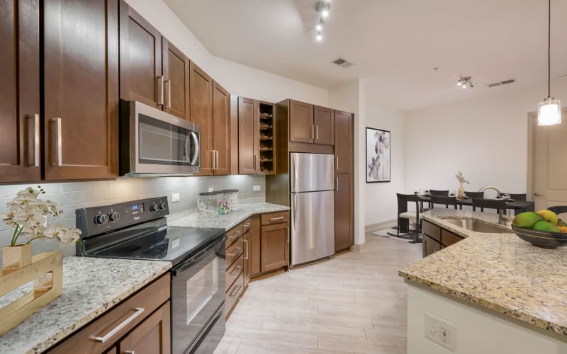 Renovated kitchen with light cabinets at Helios in Englewood, Colorado