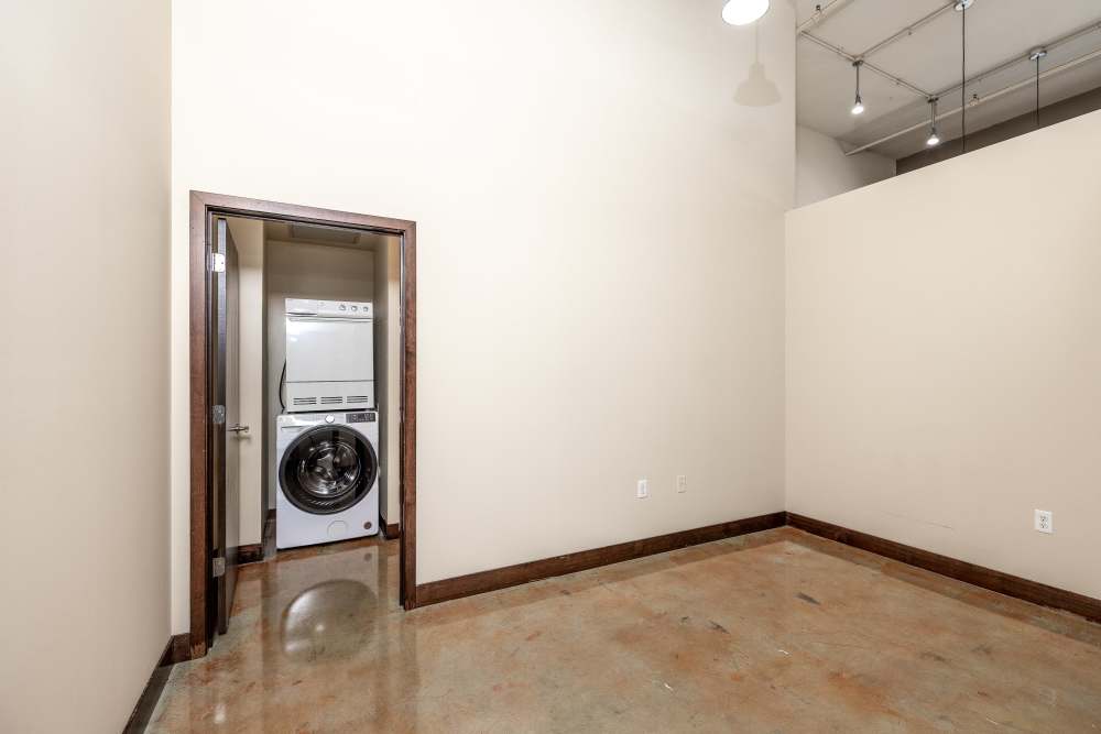 Washer and dryer in a small room at Rumely Lofts in Des Moines, Iowa