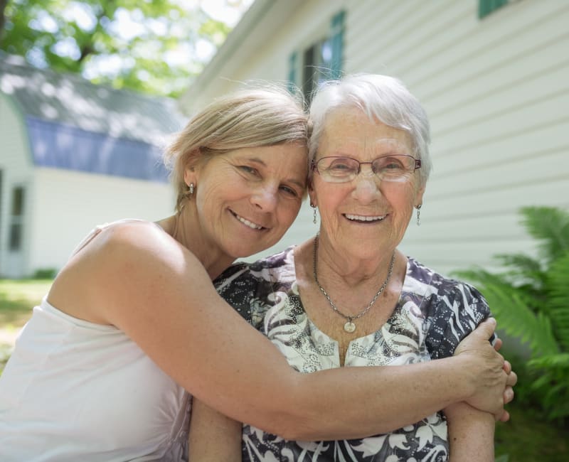 Mother and daughter embrace at The Sanctuary at West St. Paul in West St. Paul, Minnesota