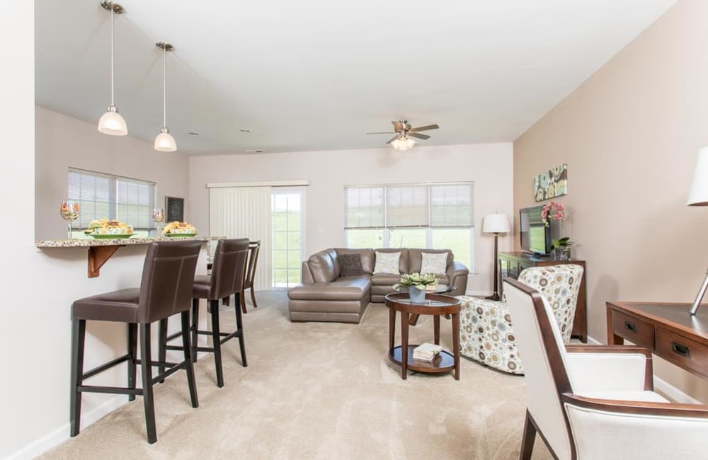 Another angle of a wonderful living room area at Preserve at Autumn Ridge in Watertown, New York.