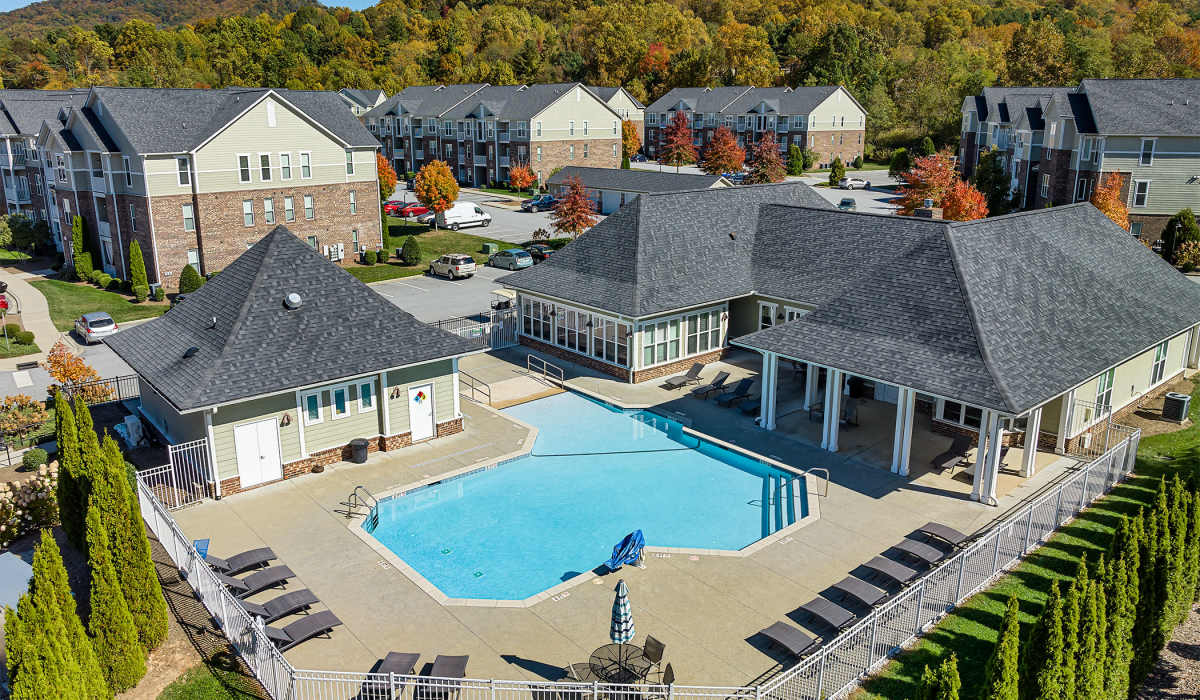 Great view of community apartments with pool at Palisades of Asheville in Asheville, North Carolina