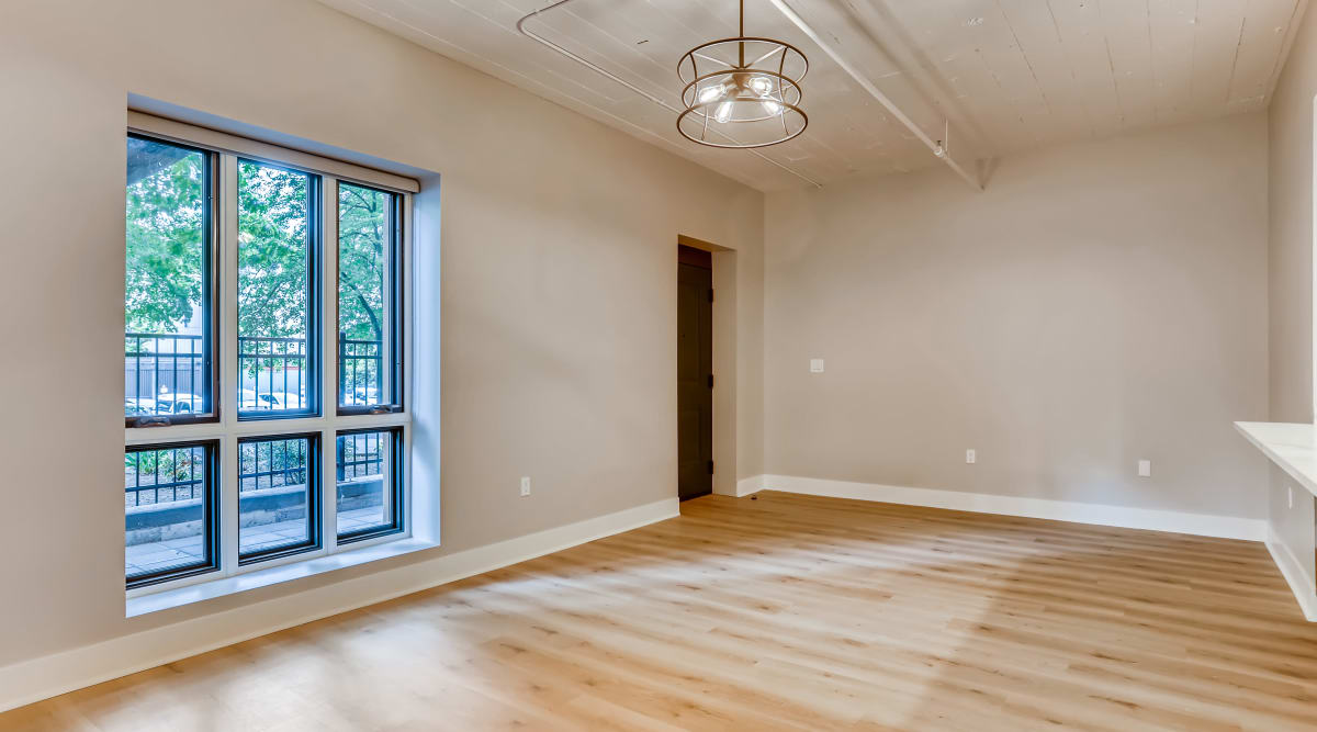 Spacious bedroom with large windows at The Mill at First Hill in Seattle, Washington