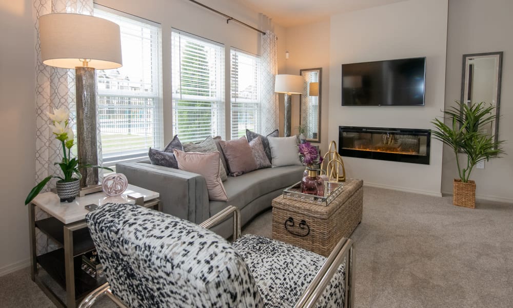 Living room with fireplace at Redbud Ranch Apartments in Broken Arrow, Oklahoma
