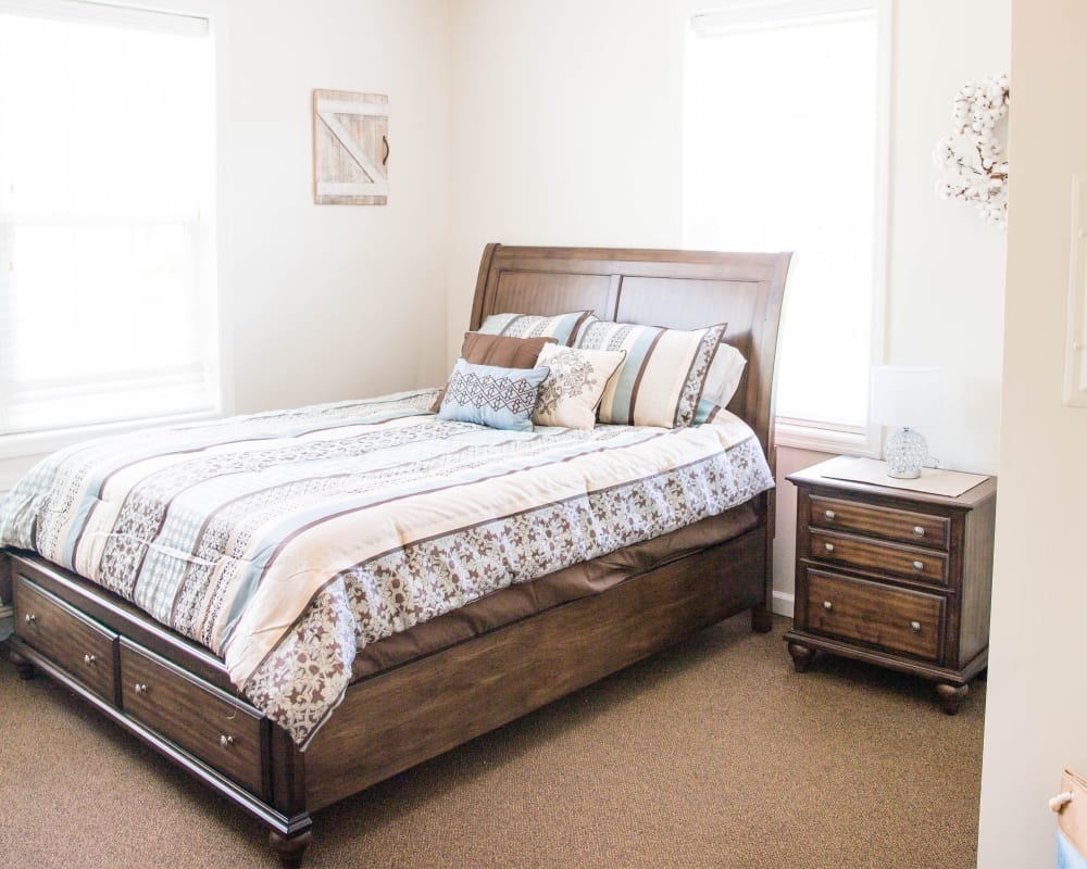 Cozy bedroom with large window at Arcadian Cove in Richmond, Kentucky.
