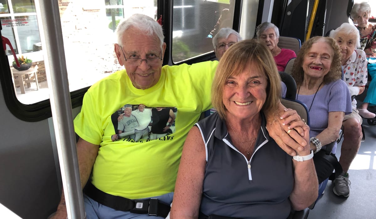 Two residents on the CERTUS Premier Memory Care Living transportation bus in Orange City, Florida.