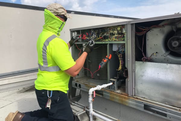 A worker looking at wires at Patriots Landing in DuPont, Washington. 