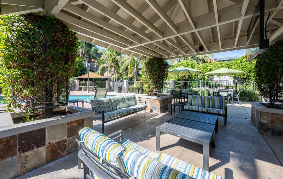 Outdoor seating at UCE Apartment Homes in Fullerton, California