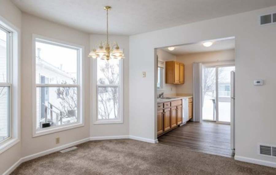 gorgeous living space with carpeting and natural light at Unionville Station Townhomes in Hilton, New York