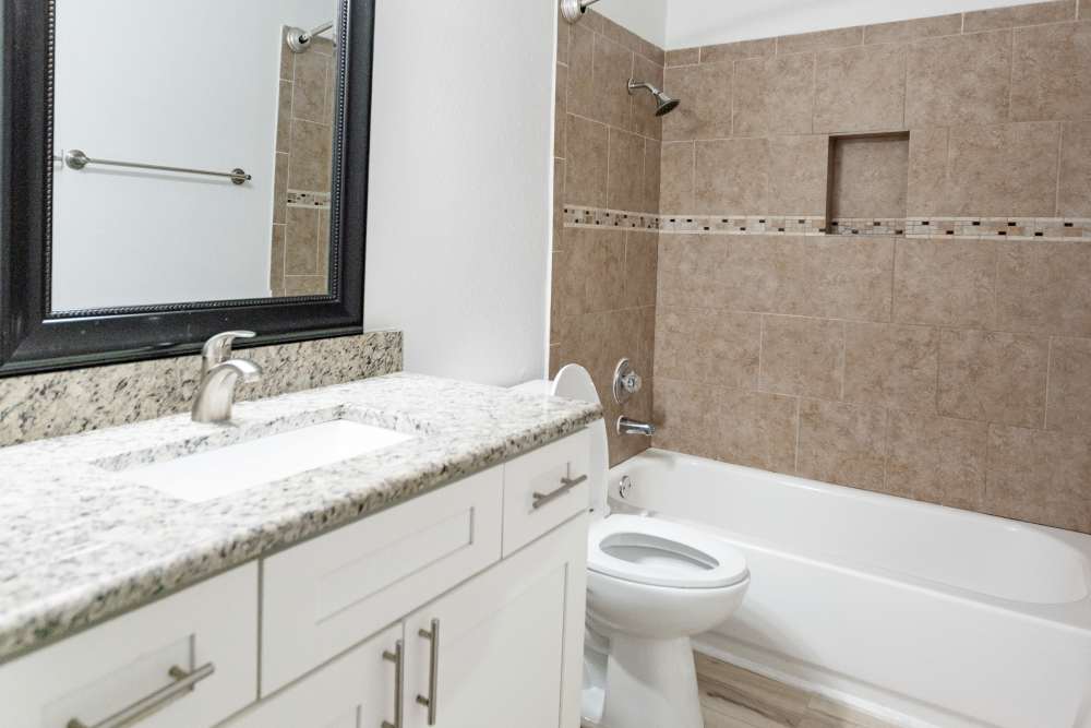 Bathroom with bathtub at Hubbards Ridge in Garland, Texas
