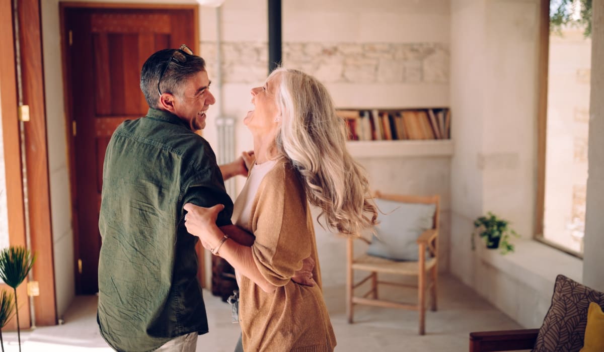 Resident couple dancing in their apartment at Towne Crest in Gaithersburg, Maryland