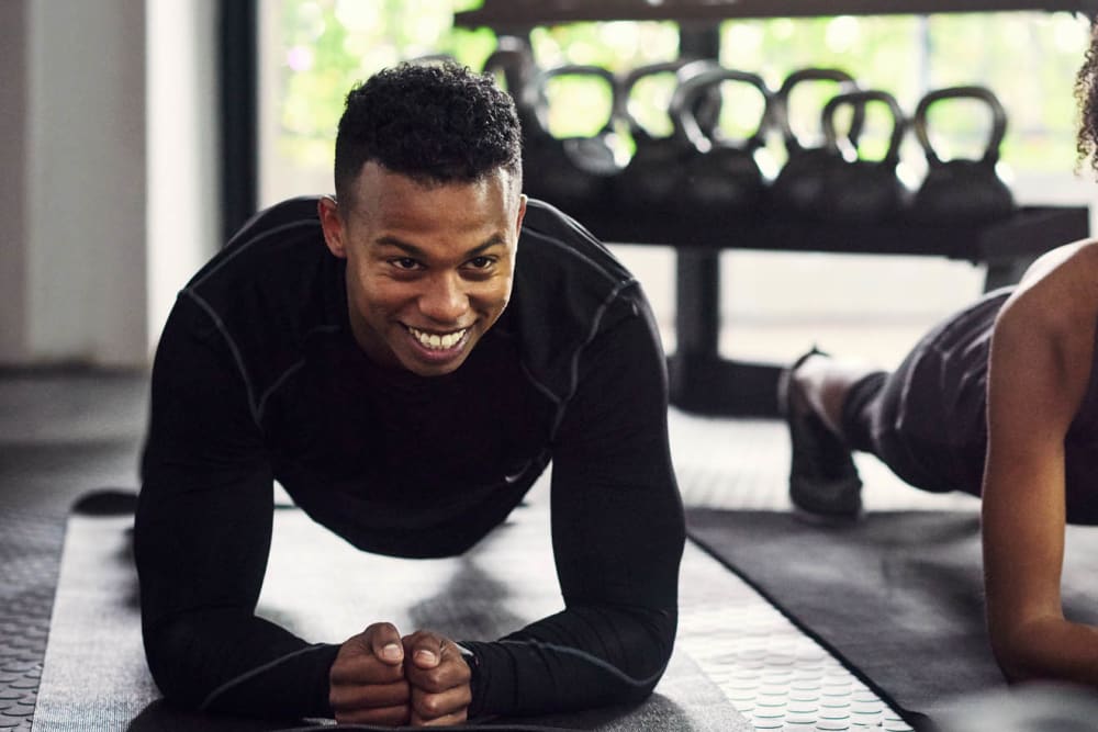 Resident staying in shape in the fitness center at Highlands at Alexander Pointe in Charlotte, North Carolina