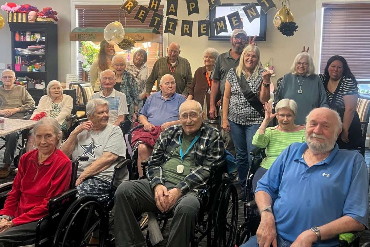 Residents in wheelchairs celebrate at a Happy Retirement event at Isle at Cedar Ridge in Cedar Park, Texas.