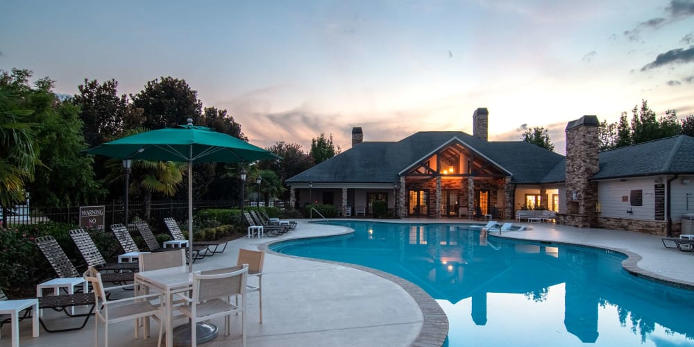 Pool view at dusk at Houston Lake Apartments in Kathleen, Georgia