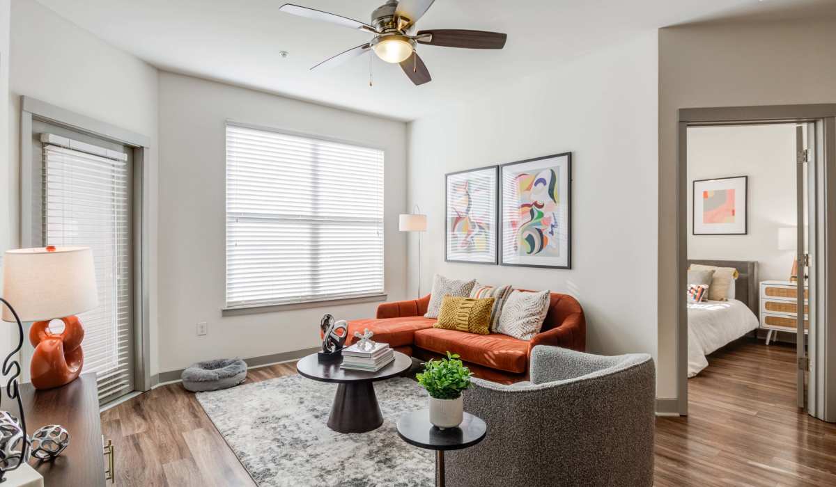 Living room with couch and ceiling fan at The Carillon in Nashville, Tennessee